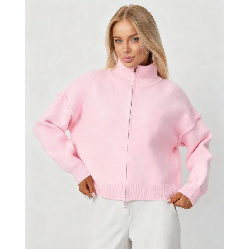 Women’s oversized zip-up cardigan sweater, light pink funnel neck, full zipper.