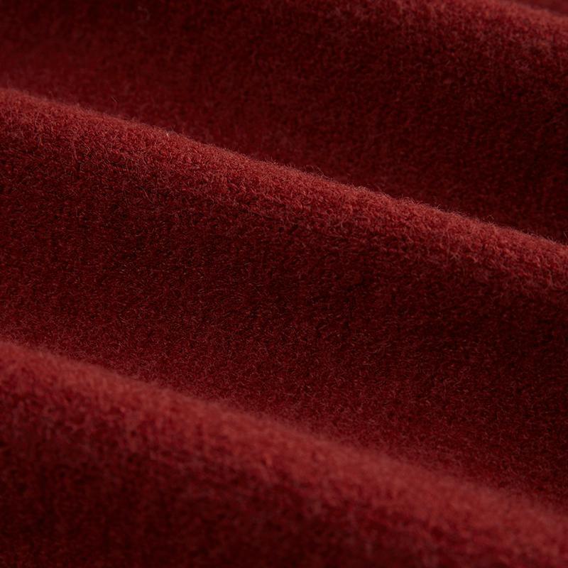 Women's knitted cardigan fabric, wine red knit texture close-up