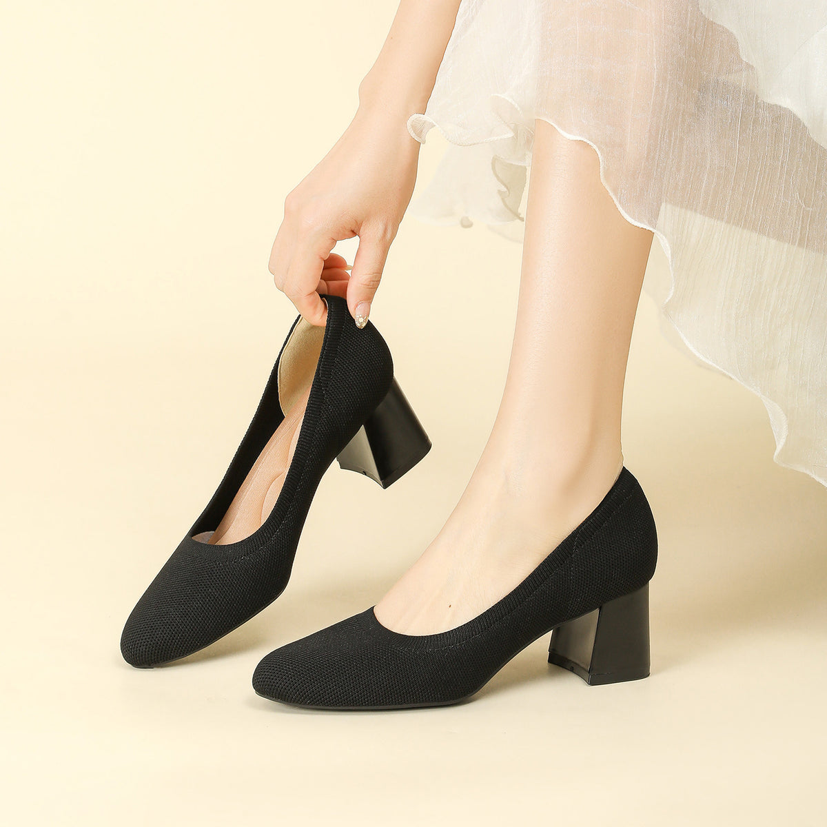 Black knit pointed-toe shallow pumps with chunky block heel