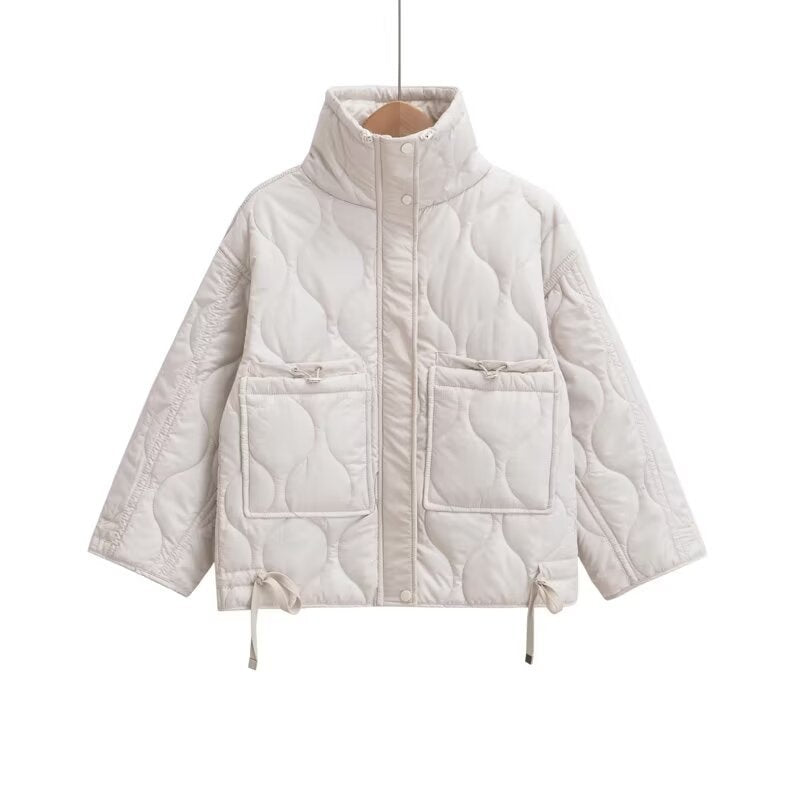White quilted stand-collar jacket with front zip and patch pockets