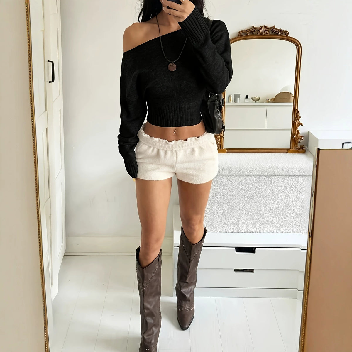 One-shoulder knit sweater in black, long ribbed sleeves, off-shoulder neckline, fitted