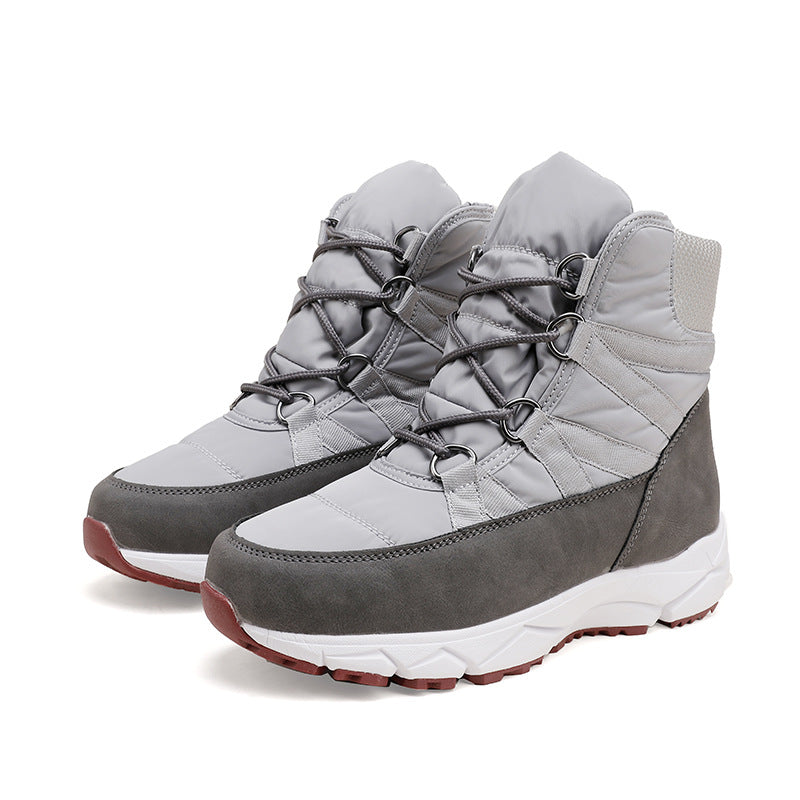 Gray lace-up snow boots with quilted uppers, dark toe-and-side panels, red tread