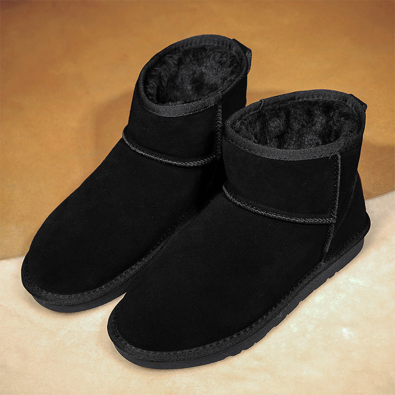 Black winter ankle boots with plush fur lining and thick cushioned sole