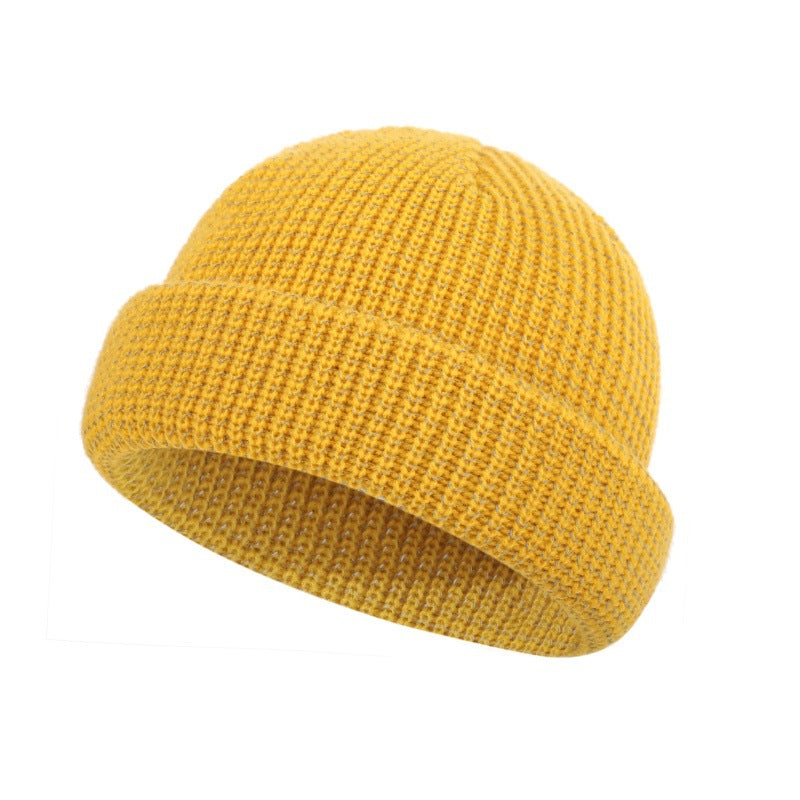 Yellow knitted beanie hat with folded cuff, textured stitch knit