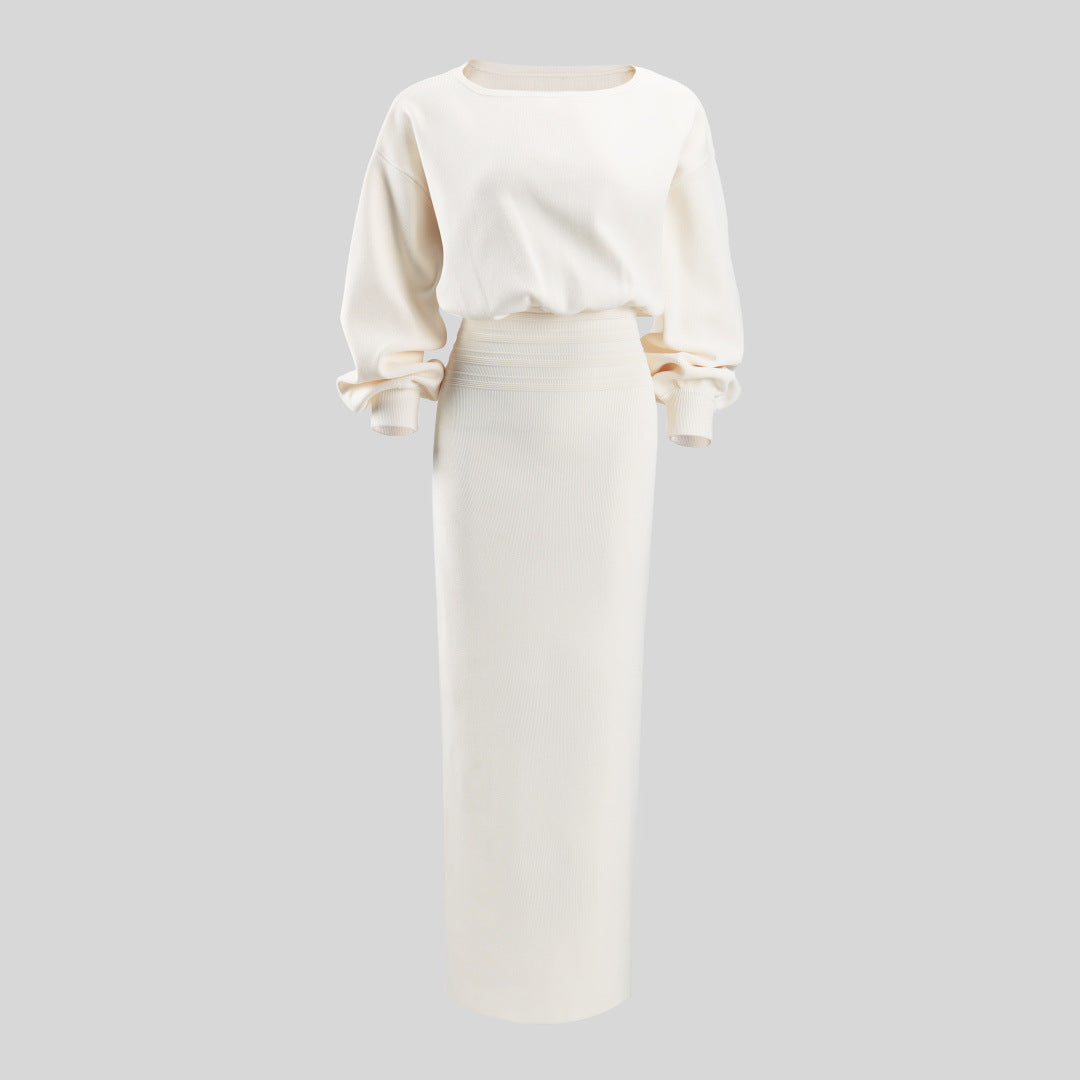 White fitted midi dress front view with long puff sleeves and cropped waist seam