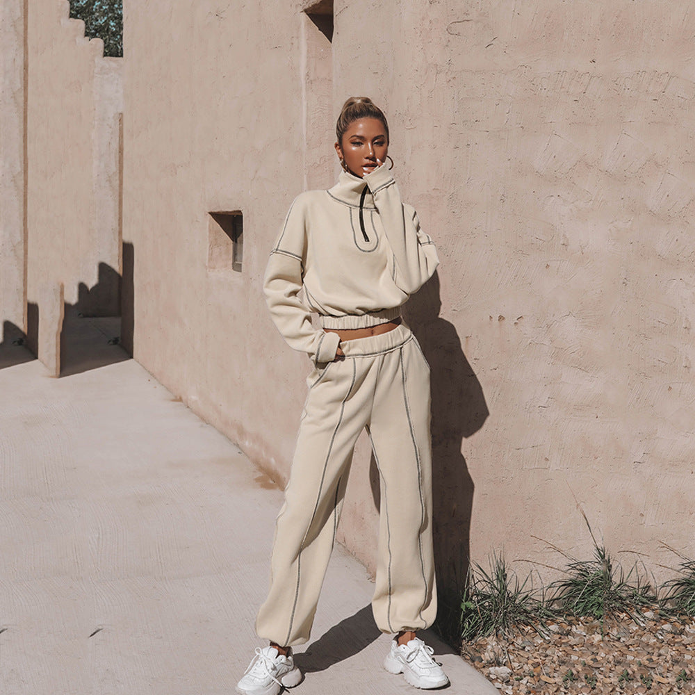 Women's light beige quarter-zip cropped sweatshirt and matching jogger pants with sneakers