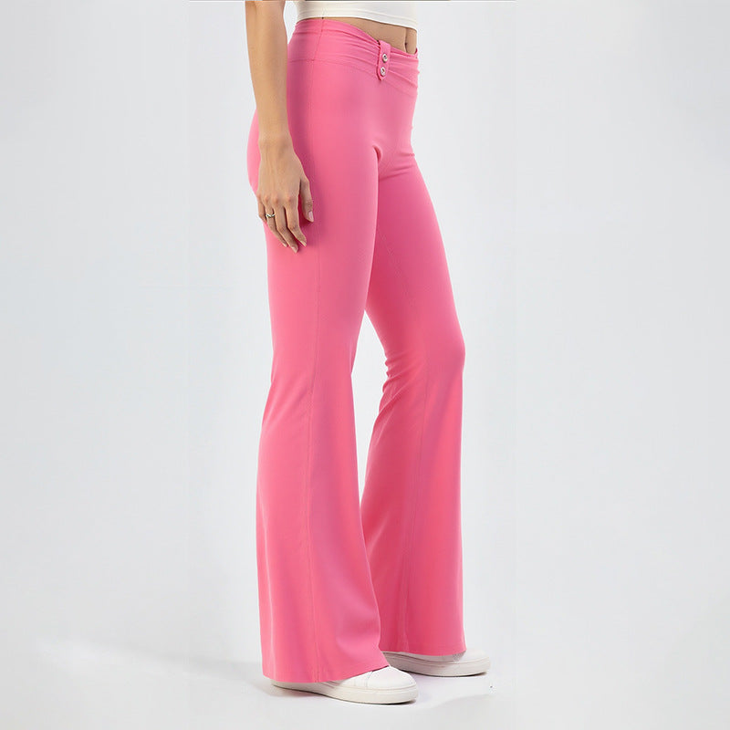 Pink high-waisted yoga flare pants with buttoned waistband, wide flared legs