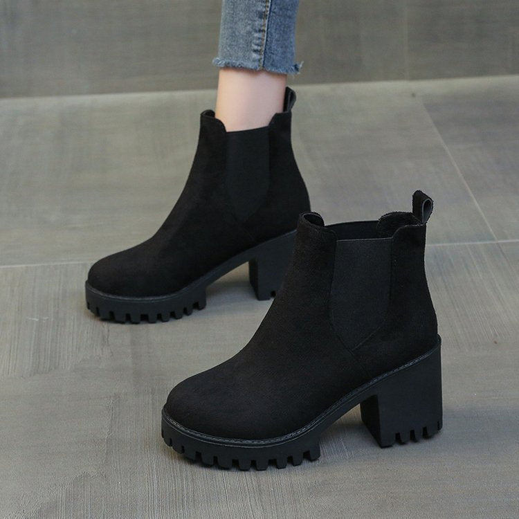 Women’s black chunky-heel Chelsea ankle boots with round toe and thick rubber sole