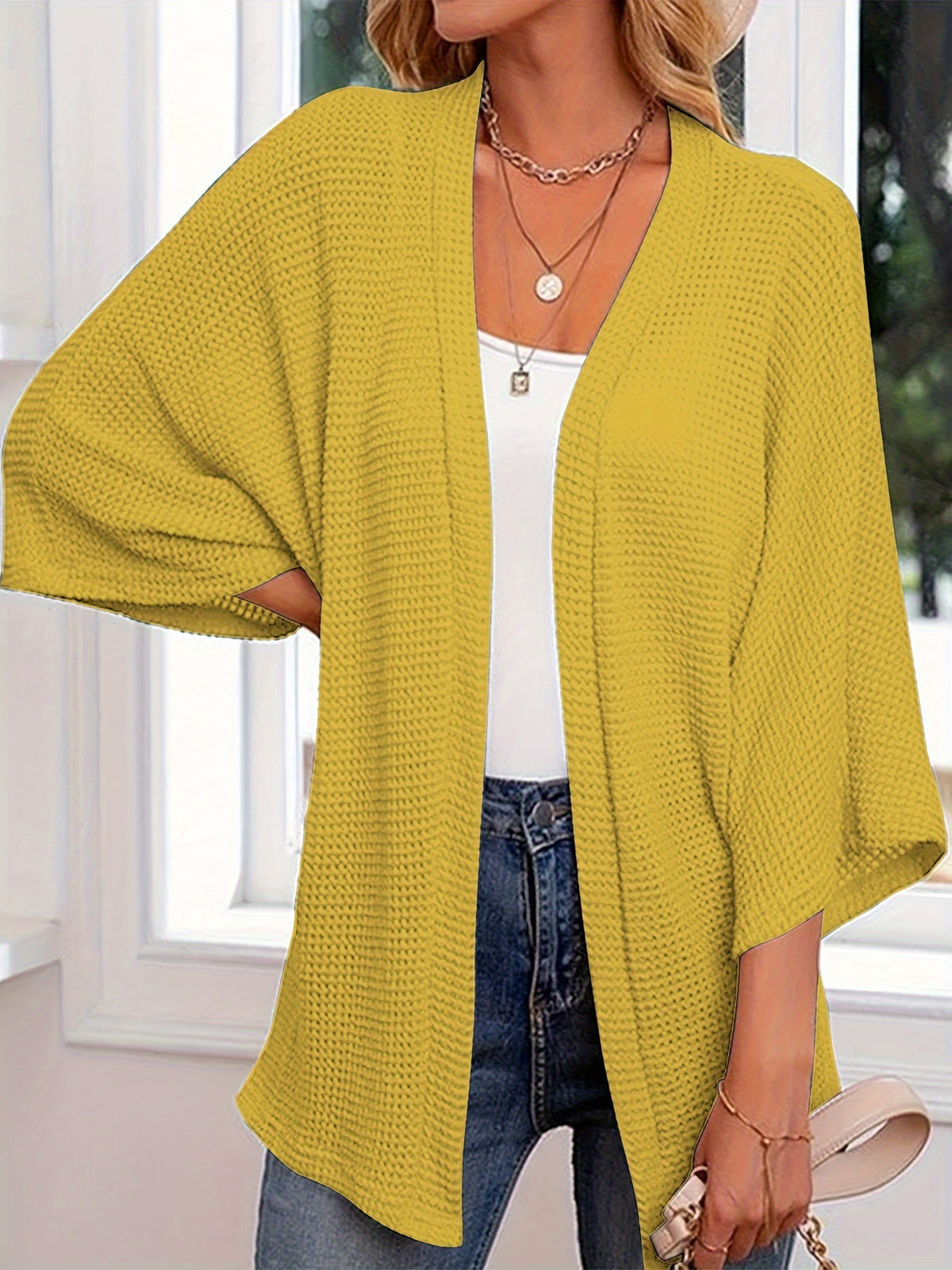 Women's loose textured knit cardigan with 3/4 sleeves, open front, yellow