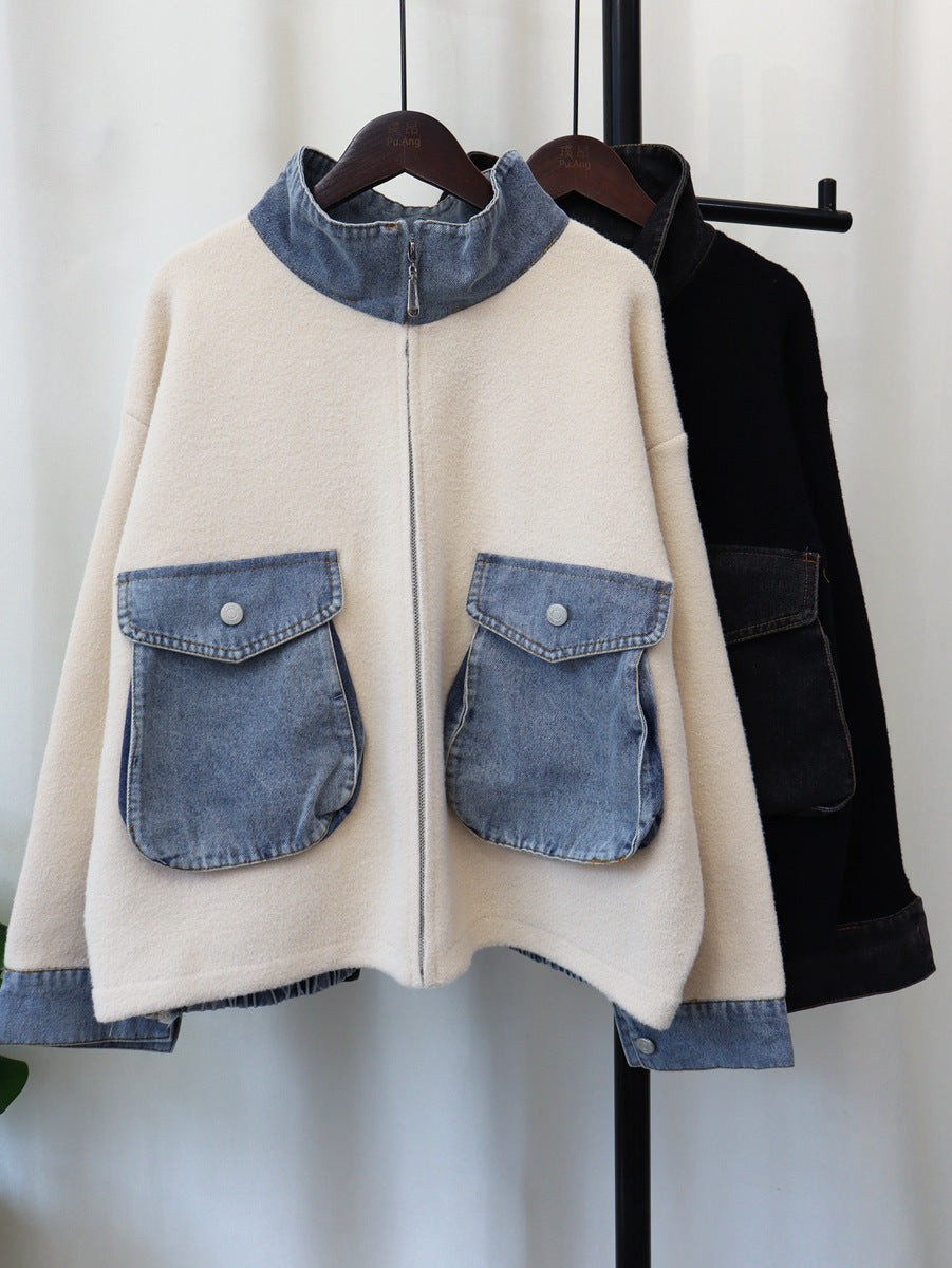 Cream knit cardigan with front zipper and blue denim patch pockets, standing collar
