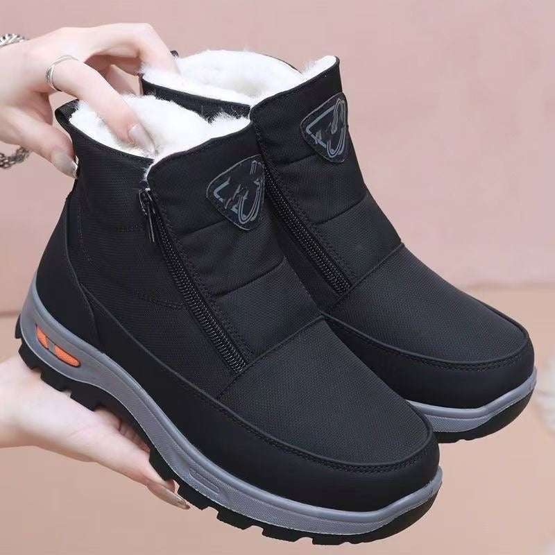 Black ankle boots with side zipper and plush lining, flat cushioned sole