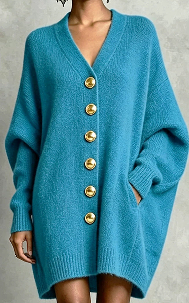 Blue V-neck knit cardigan with gold circular buttons and batwing-style sleeves