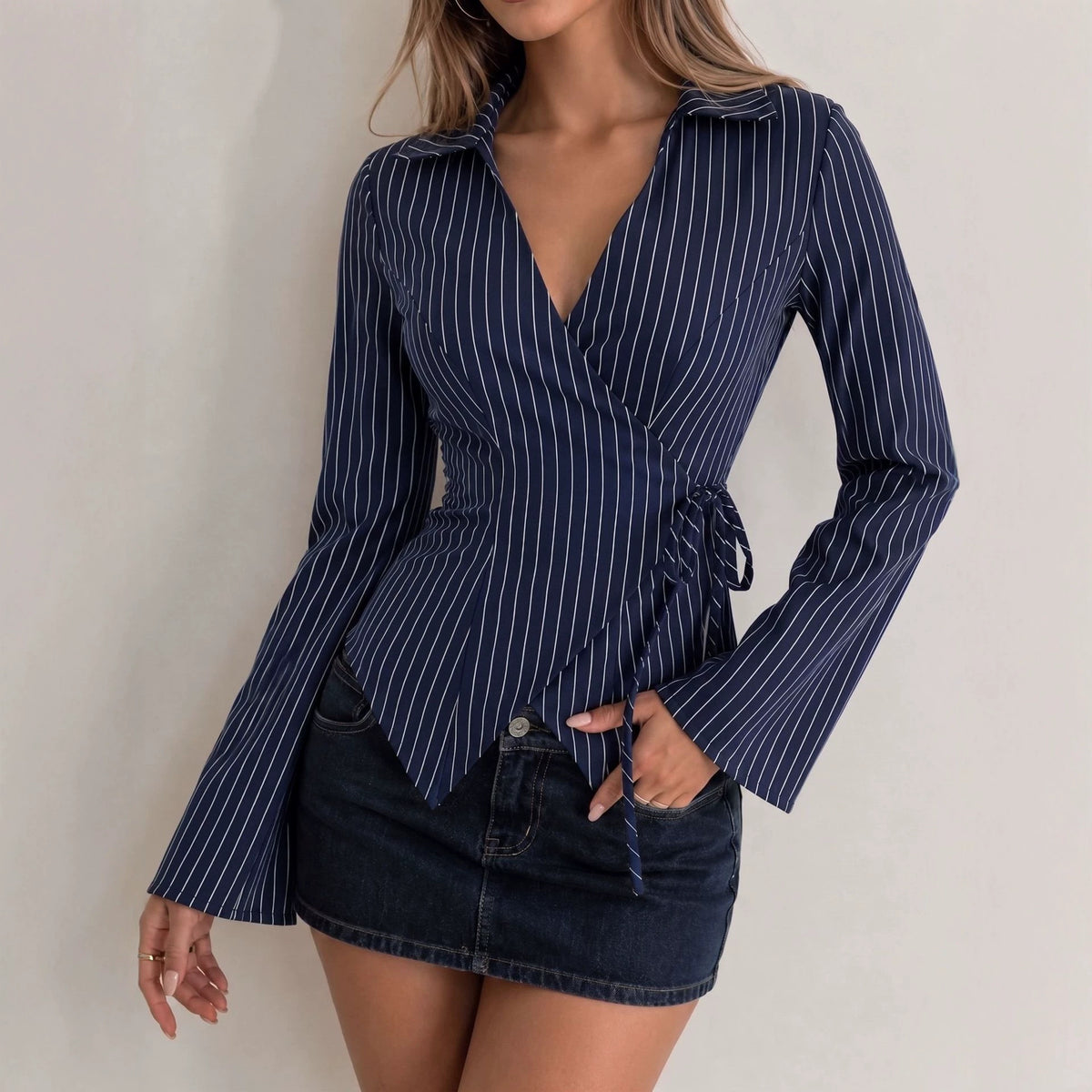 Navy striped long-sleeve blouse with bow-tie waist and flared sleeves
