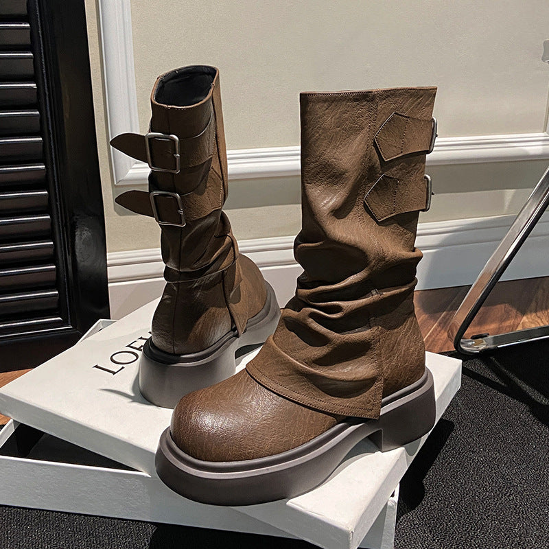 Brown slouchy mid-calf boots with two buckle straps and block heel platform