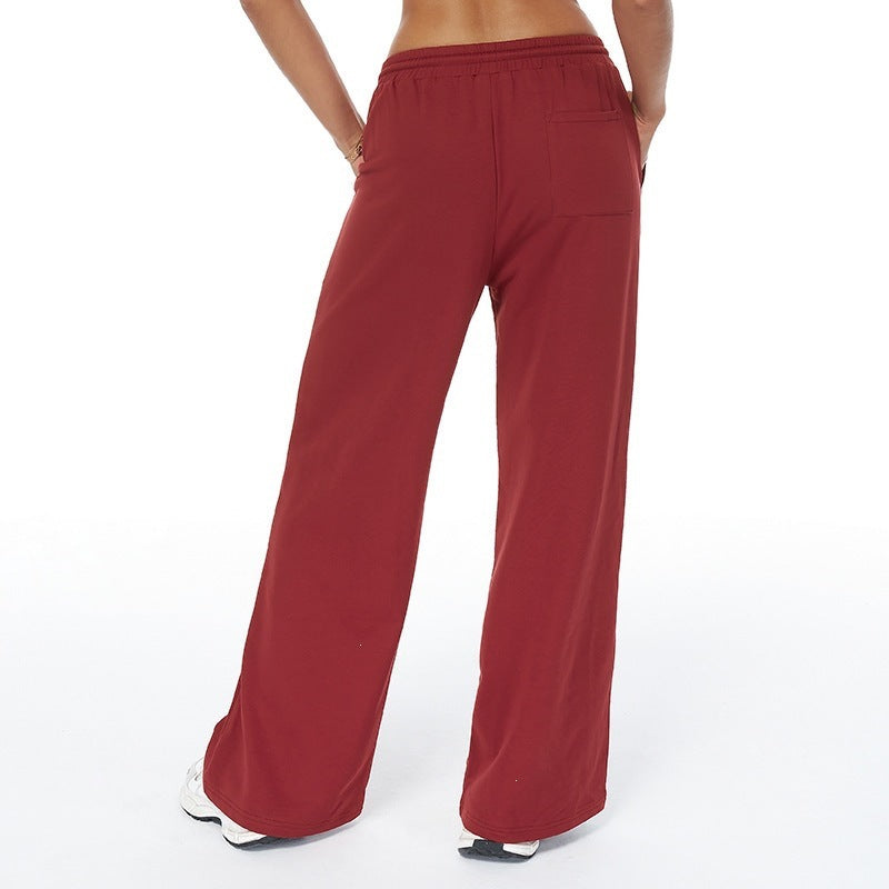 High-waisted loose sweatpants with straight legs, drawstring and side pockets, red