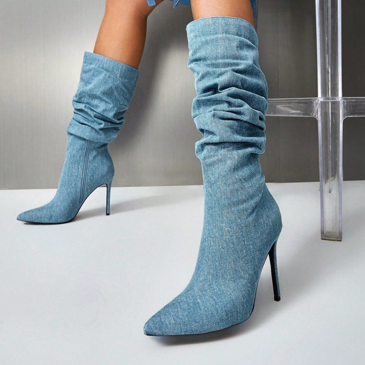 Blue suede over-the-knee stiletto boots with ruched slouchy shaft and pointed toe