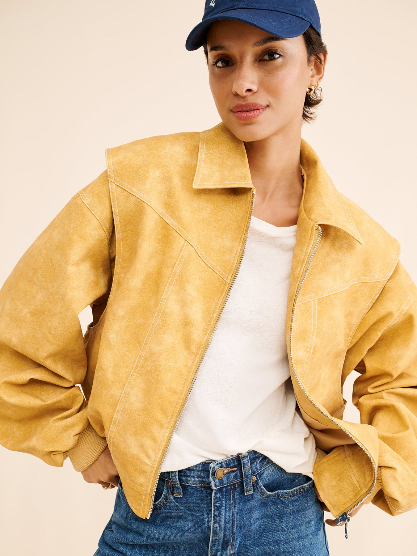 Yellow faux suede bomber jacket, oversized cropped fit, contrast topstitching, zip front