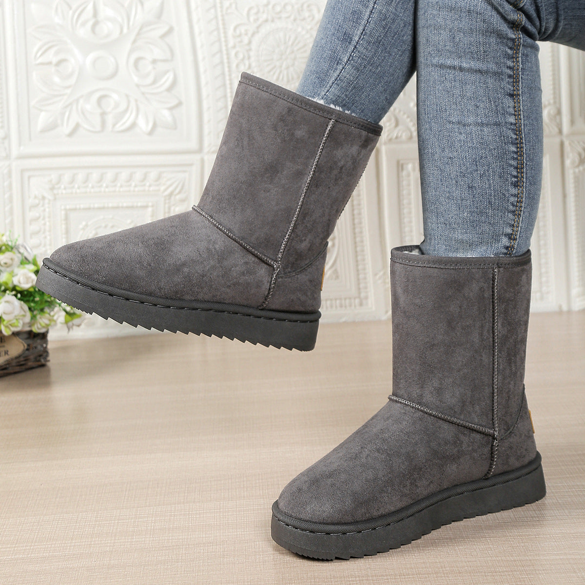 Women’s mid-calf fleece-lined slip-on snow boots in gray suede with flat rubber sole