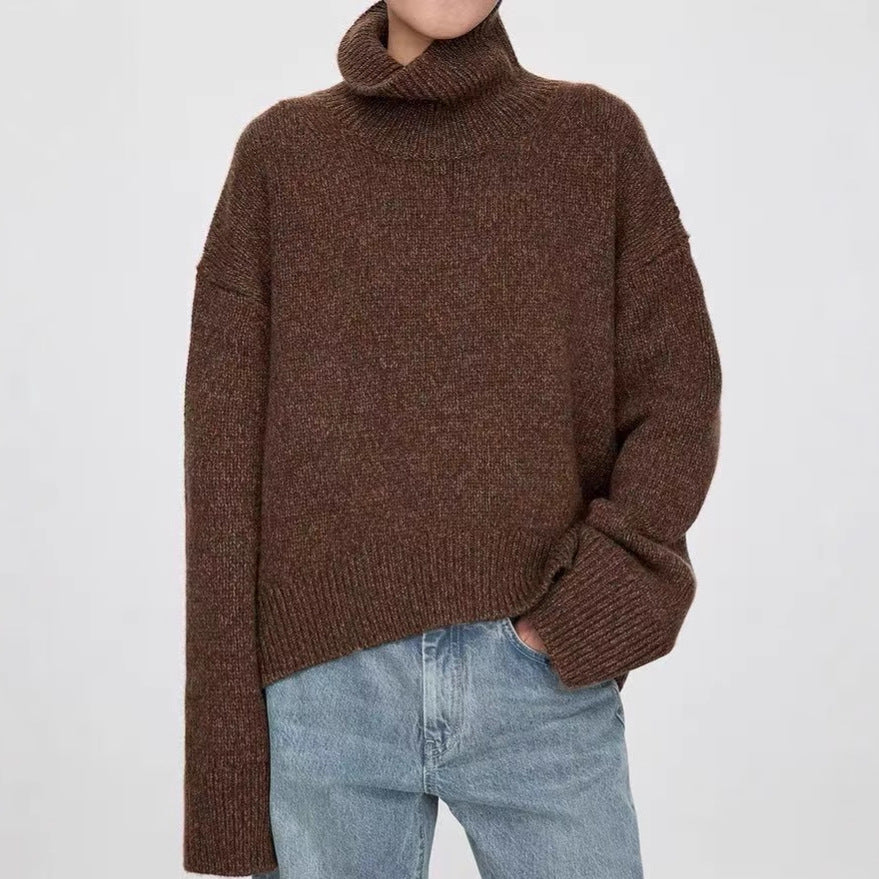 Brown knitted turtleneck sweater with long relaxed sleeves and ribbed neckline