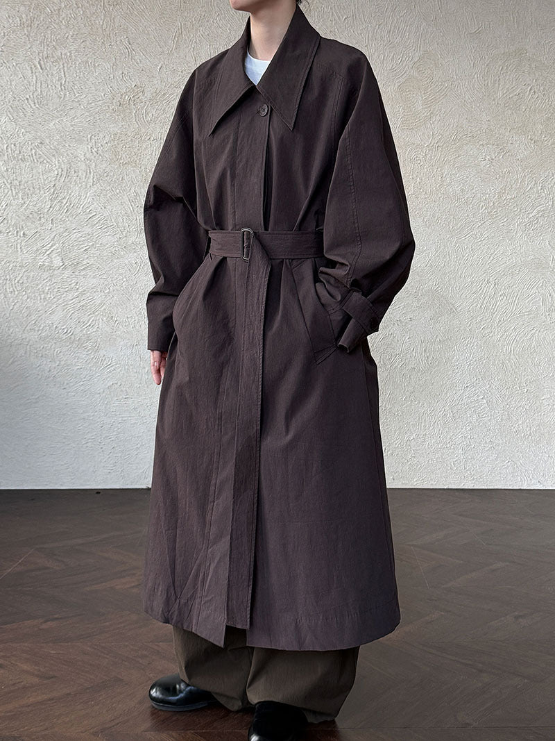 Women’s dark brown long lapel trench coat with belt tie waist and button placket