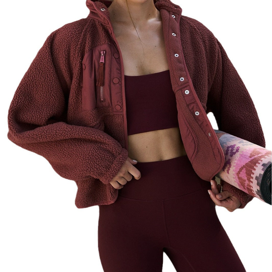 Women’s burgundy plush jacket close-up with vertical collar and button front