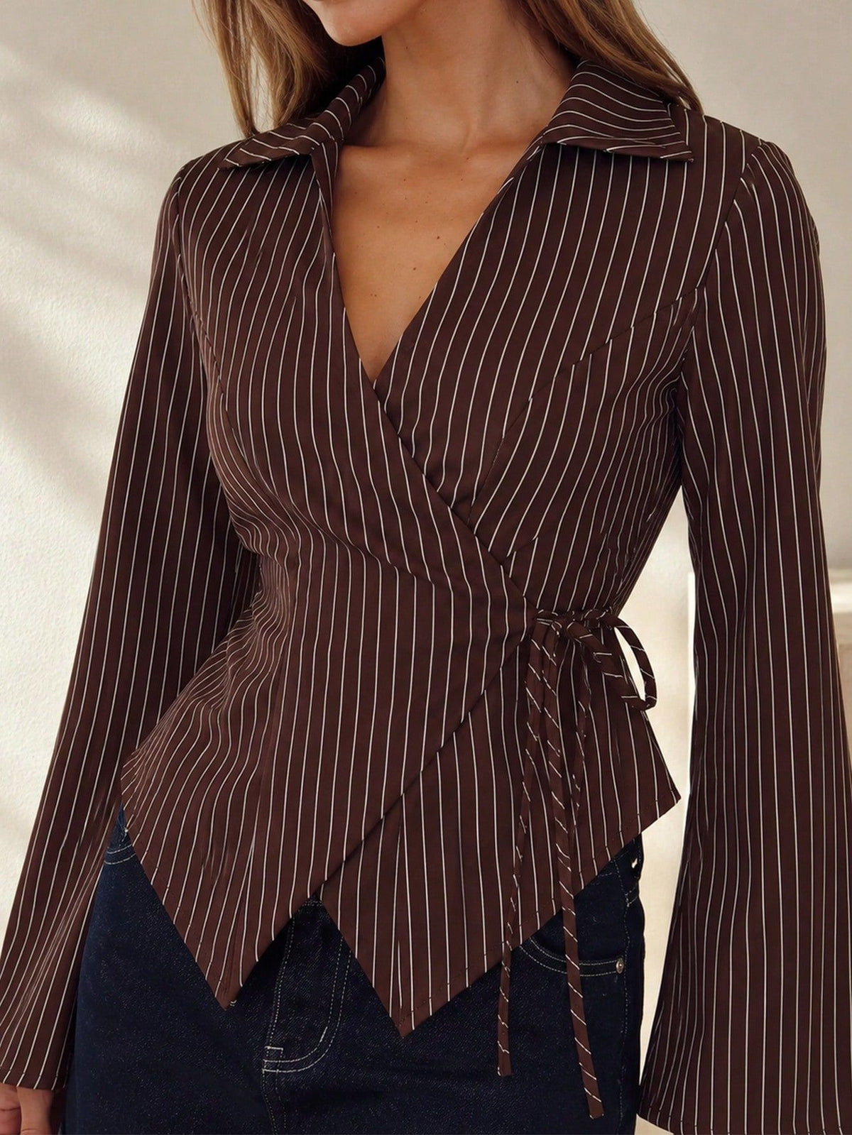 Brown pinstripe collared blouse with tied waist and flared long sleeves
