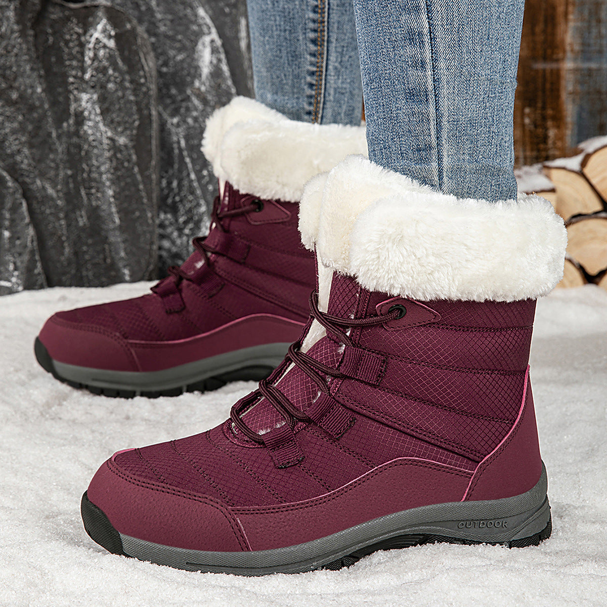 Women’s dark red mid-top winter snow boots with faux fur cuffs, lace-up, grippy sole