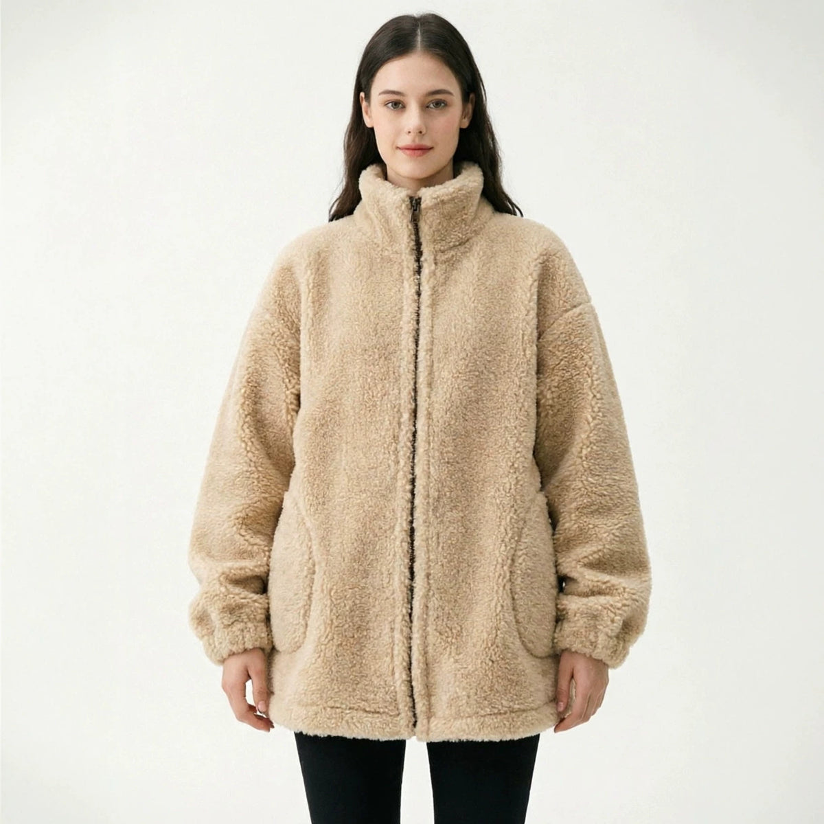Women’s beige sherpa full-zip coat with stand collar, long sleeves, and elastic cuffs