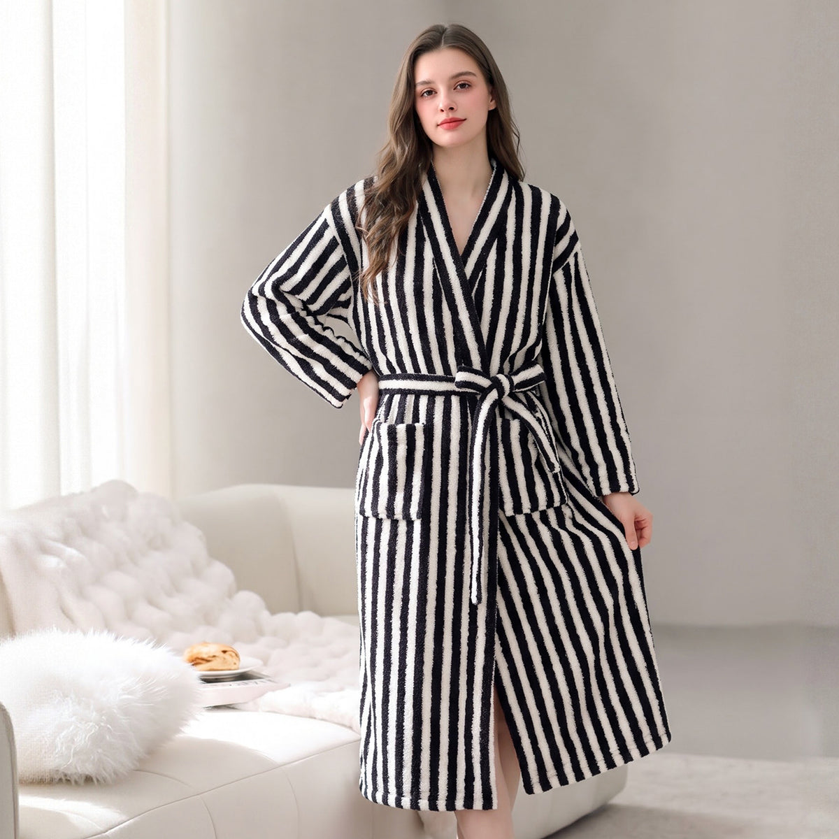 Black and white striped fleece robe with shawl collar and tie belt, open front.