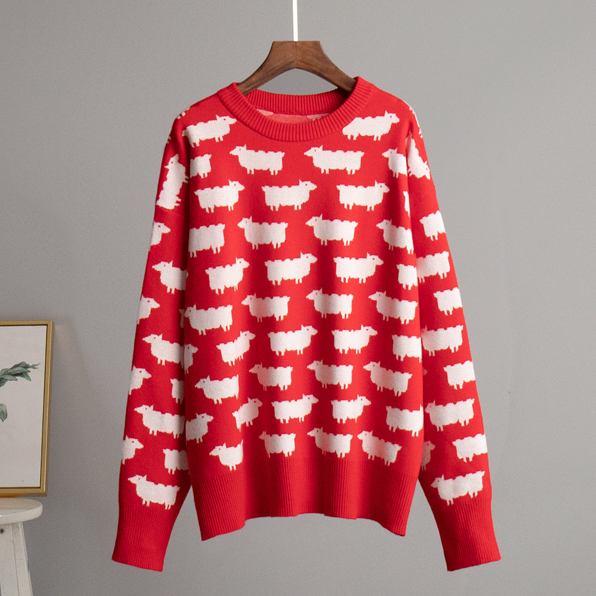 Women’s crewneck knit sweater, red with white sheep pattern, long sleeves