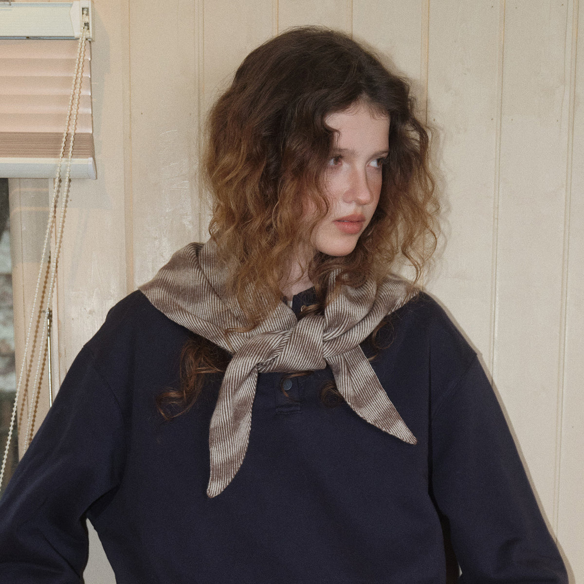 Triangle knit scarf with wavy stripes in brown and light gray