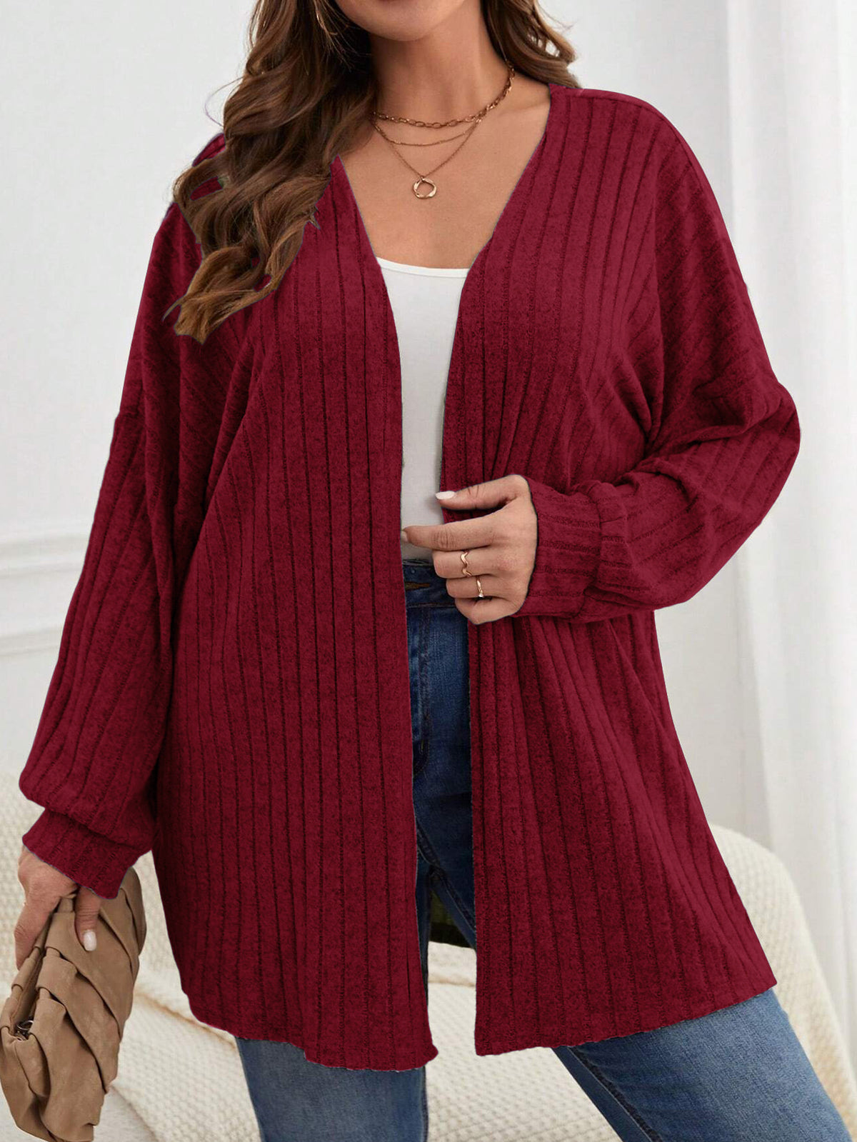 Wine red plus-size knitted long-sleeve jacket with ribbed texture, open front, mid-length.