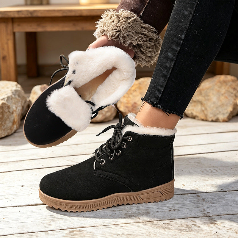 Black fleece-lined lace-up ankle boot with thick sole; soft lining shown folded out.