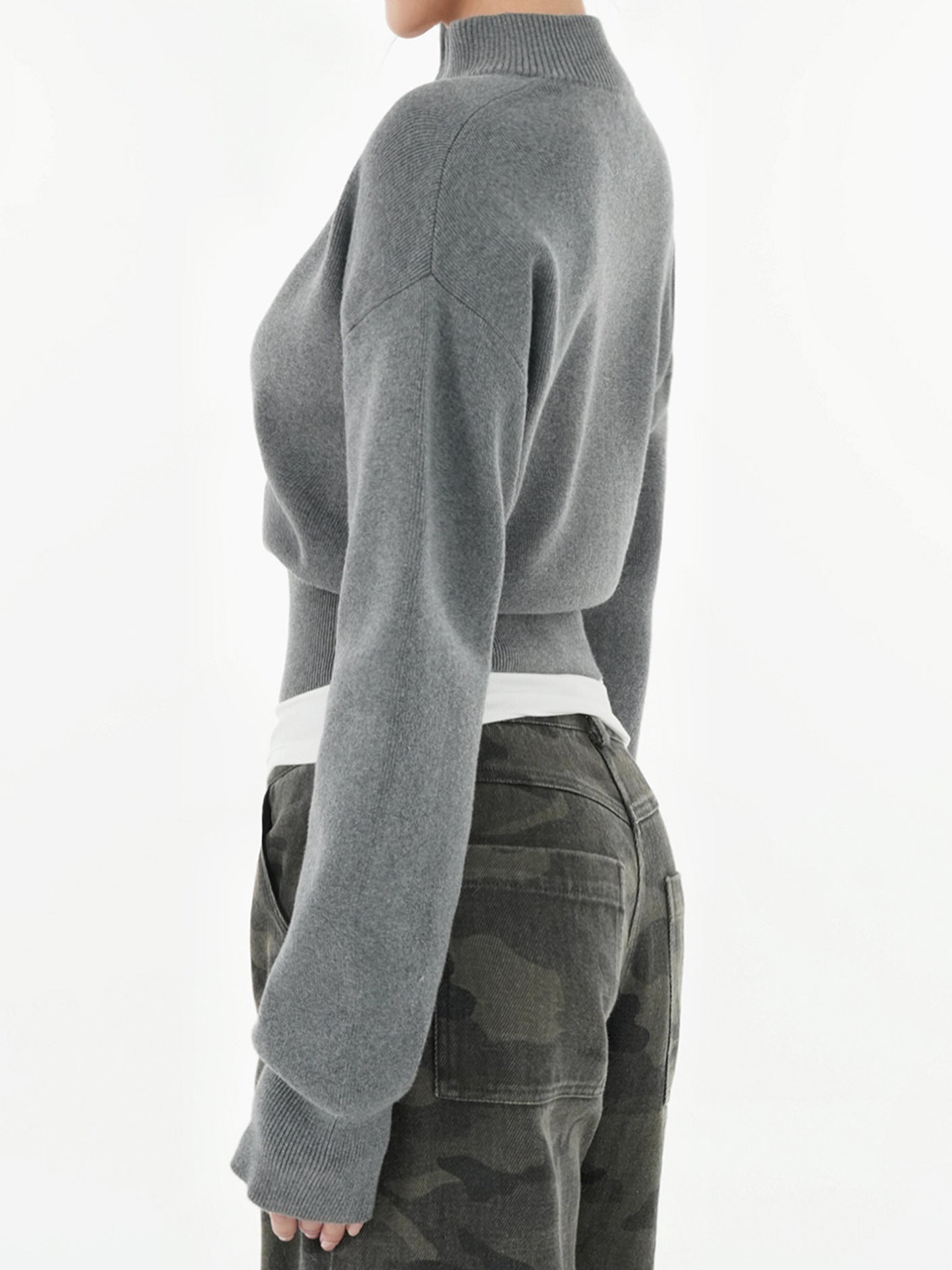 Gray zip-up mock neck knit cardigan with ribbed cuffs and ribbed waist