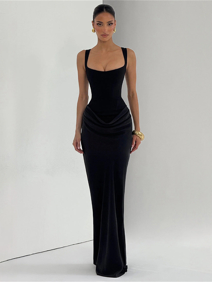 Black sleeveless bodycon maxi dress with thin straps and ruched draped waist