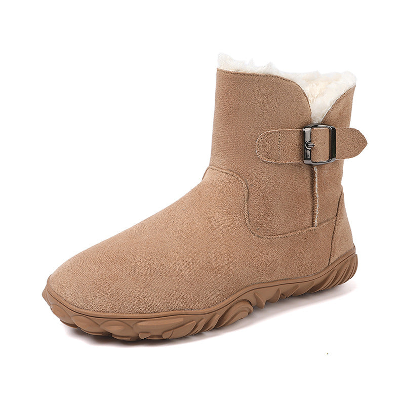 Tan flat ankle snow boot with faux fur lining and side buckle strap, gripped rubber sole