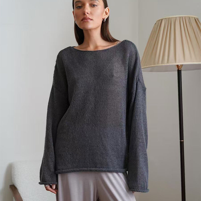 Charcoal gray women’s loose knit sweater top with round neck and long sleeves