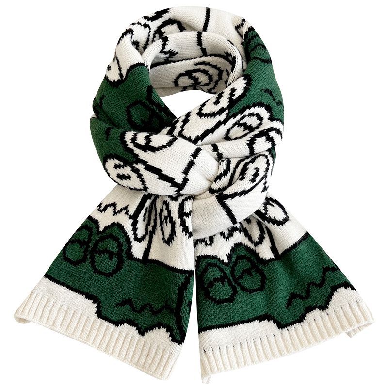 Green and white patterned knitted scarf with ribbed ends, folded cowl-style drape