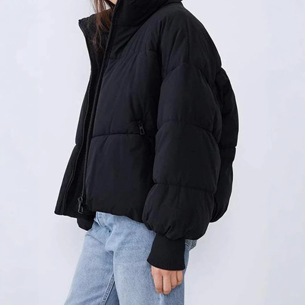Women’s quilted cotton winter jacket, black, full-zip, side view with ribbed cuffs