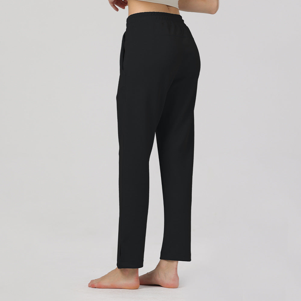 Black elastic-waist cotton pants with straight legs and ankle-length hems