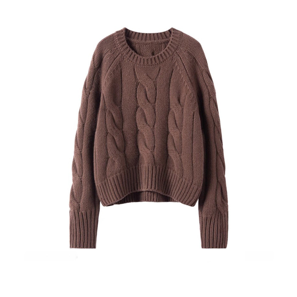 Brown cable-knit turtleneck sweater with textured stitch pattern and ribbed trim.