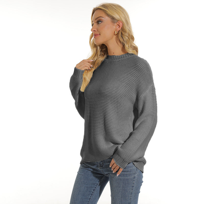 Women’s dark gray knit pullover sweater with crew neck, long sleeves and ribbed cuffs