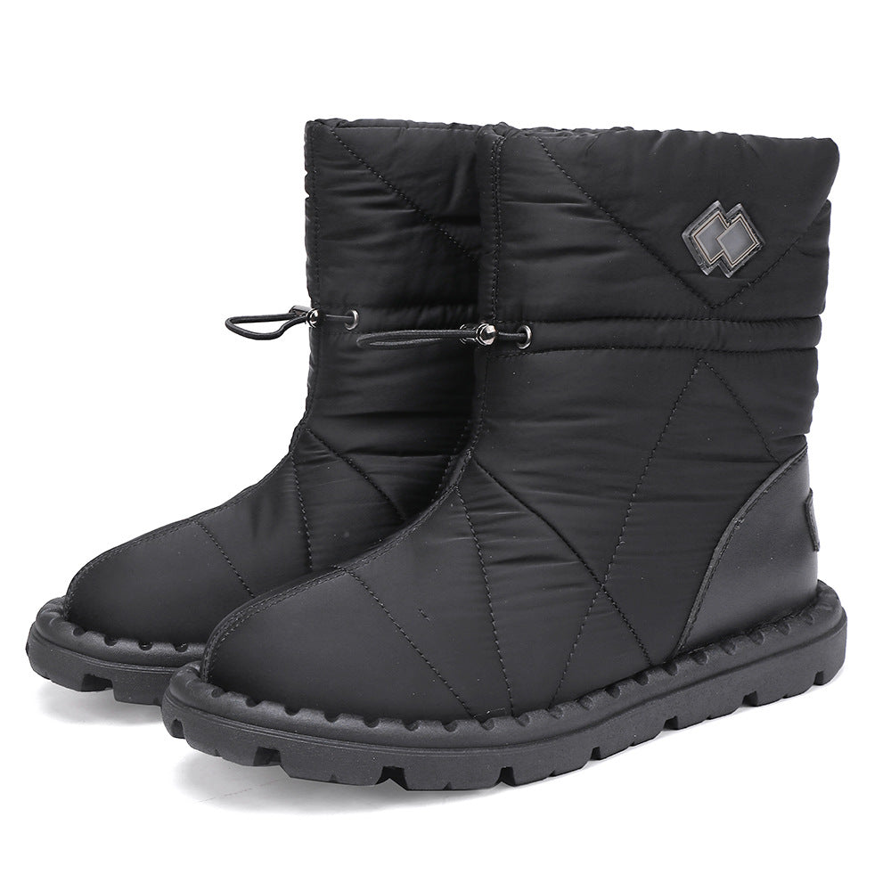 Black quilted mid-calf snow boots with lace-up ties, padded collar, and rubber tread sole.