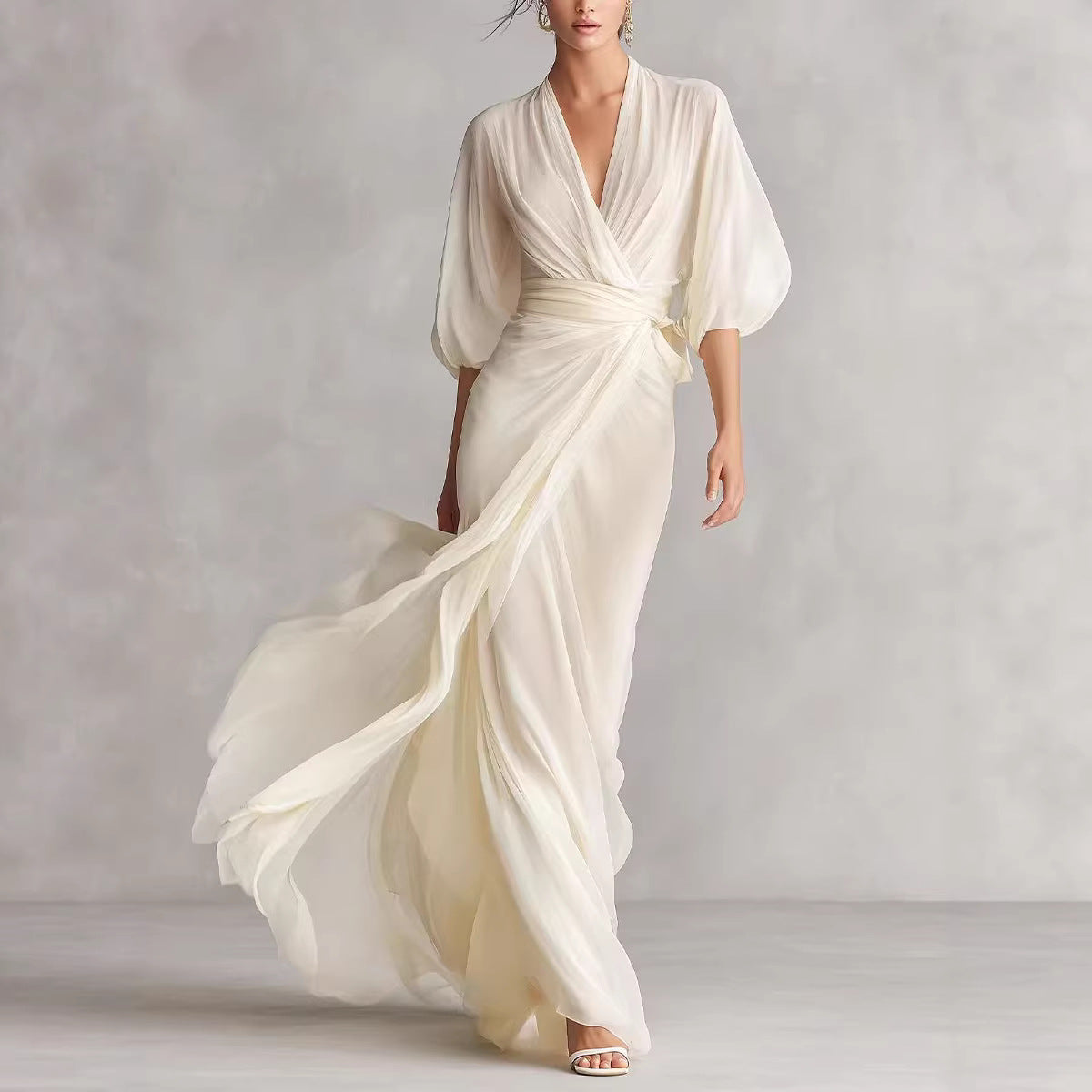 Off-white long dress with deep V-neck, lantern sleeves, cinched waist, flowing skirt