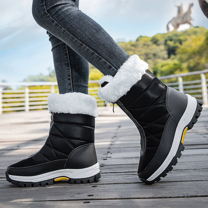 Black winter snow boots with white faux-fur cuffs, side zipper, thick tread outsole