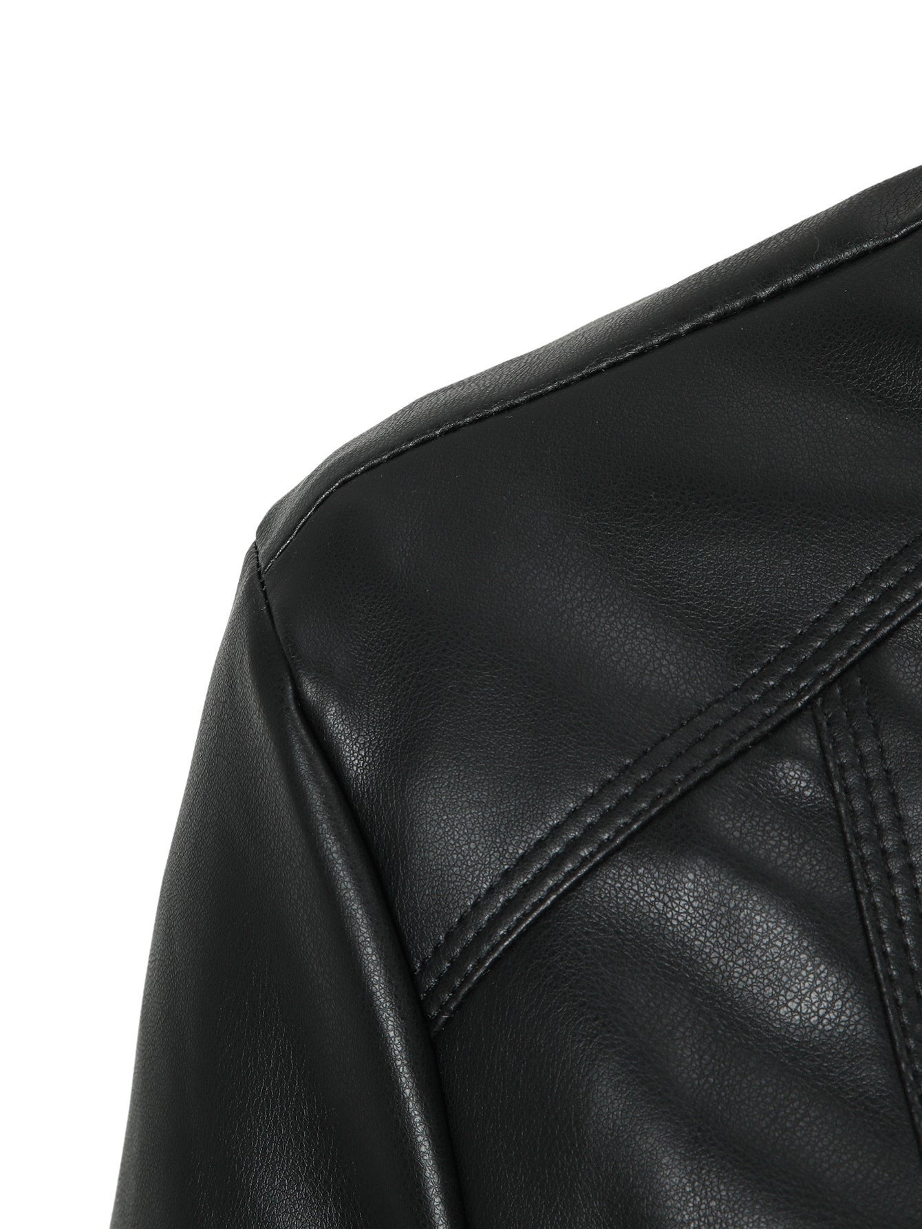 Black faux leather moto jacket shoulder and seam detail with curved panel stitching