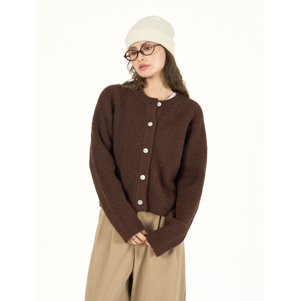 Brown round-neck cardigan with long sleeves and pale buttons