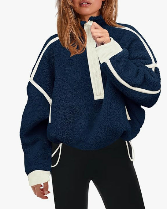 Navy plush zip sweatshirt with white zipper and contrast stripe piping along sleeves.