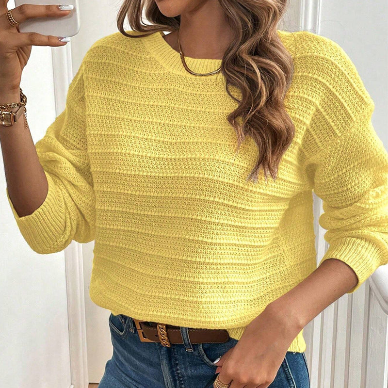 Yellow knit sweater with crew neck and long sleeves