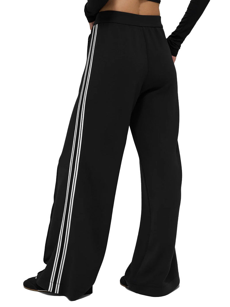 Black wide-leg pants with vertical white stripe accents and relaxed straight drape